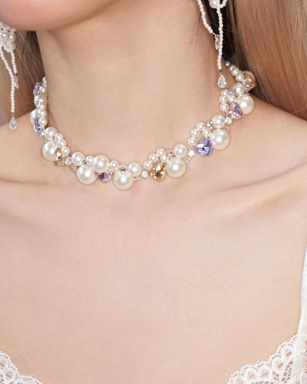 Pearl and crystal heart choker worn with matching drop earrings
